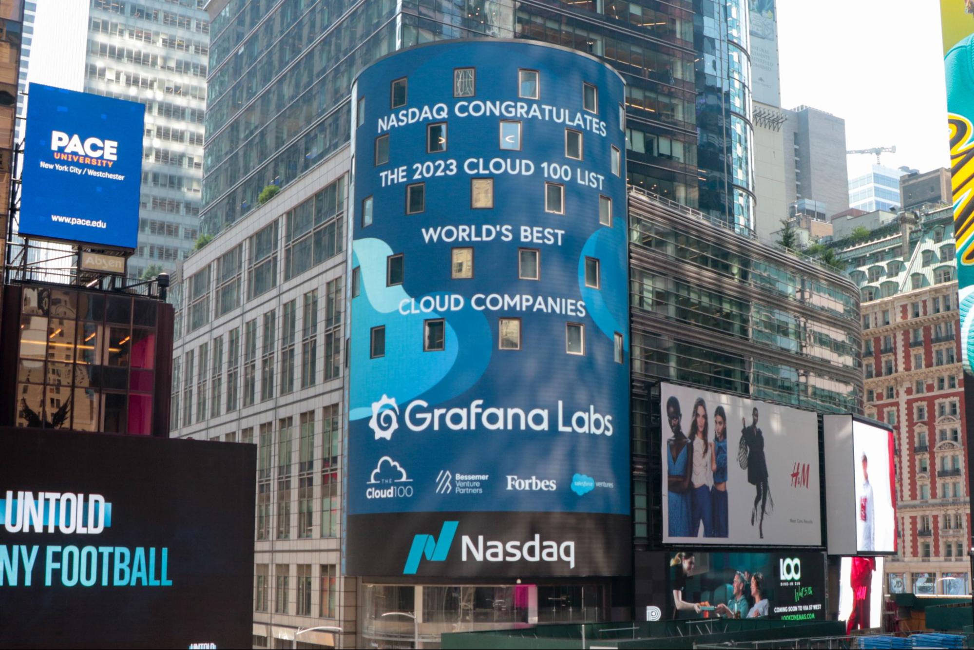 *Grafana Labs on the Forbes Cloud 100 list.* A photo of Grafana Labs listed on the Forbes 100 list on the Nasdaq Tower.